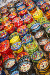 Fototapeta na wymiar Hand Painted Turkish Bowls on Table at the Market