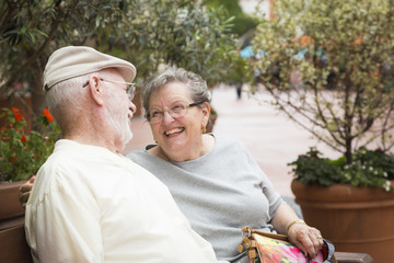 Senior Couple on Bench in the Market Place