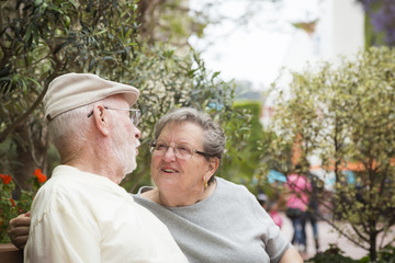Fototapeta premium Senior Couple on Bench in the Market Place