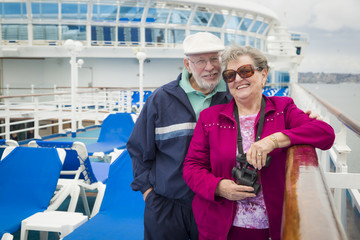Senior Couple Enjoying The Deck of a Cruise Ship
