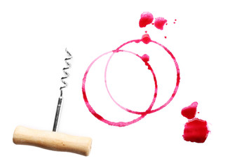 Wine stains and corkscrew isolated on white
