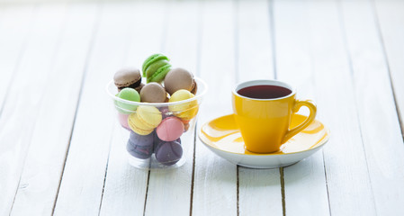 Cup of coffee and macarons