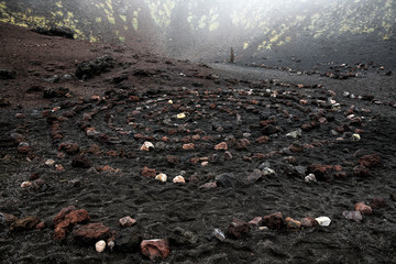 Sacred spiral of igneous rock in Etna volcano crater