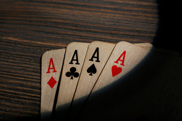 Playing cards on wooden background