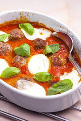 baked Bolognese balls with tomato, basil and fresh bull mozzarel