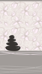 Obraz na płótnie Canvas Spa background of black pebble decorated with flowers