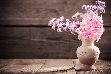 spring flowers on wooden background