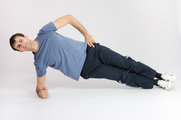 Fototapeta premium Athlete holding body leaning on the right arm