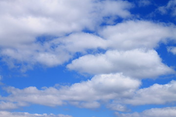 April blue sky with gray and white clouds