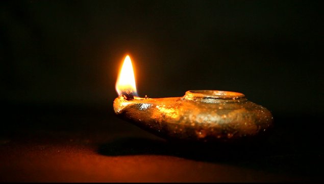 Olive oil clay ancient lantern lamp - flame in motion