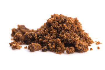 brown muscovado sugar isolated on a white background