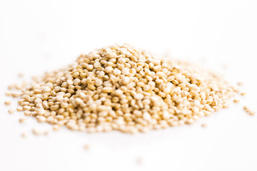 Pile of quinoa grain on a white background