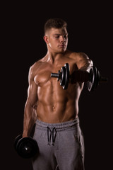 Fototapeta na wymiar muscular man bodybuilder lifting weight