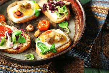 Tasty sandwiches on old pan, close up