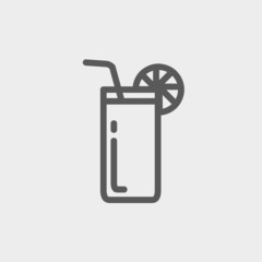 Orange juice glass with drinking straw thin line icon