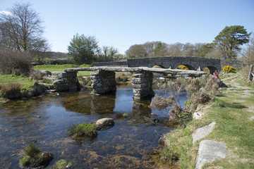 Ancient Clapper bridge at Postbrige on Dartmoor Devon UK