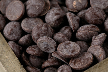 dark chocolate chips in woden box