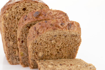 Slices of brown bread on table