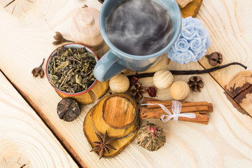 Tea cups with teapot on old wooden table