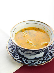 Bowl of chicken soup with vegetables and noodles