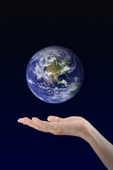 Woman hand holding Earth planet