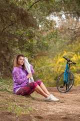 young girl with bicycle outdoor