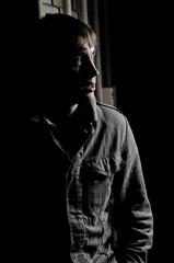 Young man in the shadow