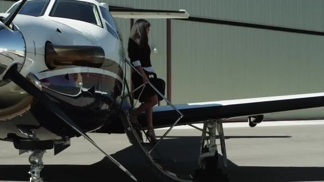 WS PAN MS Businessman disembarking private airplane / Spanish Fork, Utah, USA