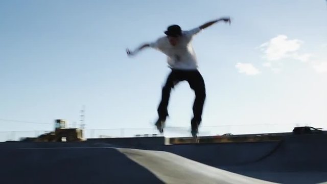 WS T/S Skateboarder sliding ramp in skatepark / Orem, Utah, USA
