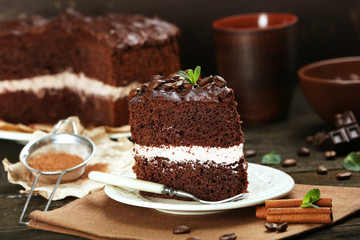 Fototapeta na wymiar Delicious chocolate cake on table on brown background