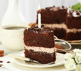 Delicious chocolate cake on table on light background