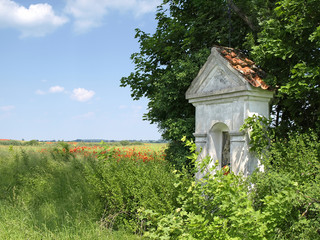 old small chapel on a meadow