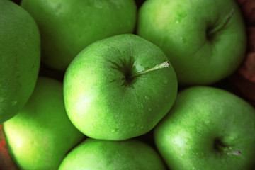 Green apples in bowl, closeup