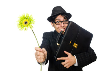 Young man in black costume with flower isolated on white