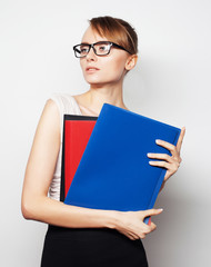 young businesswoman holding folders