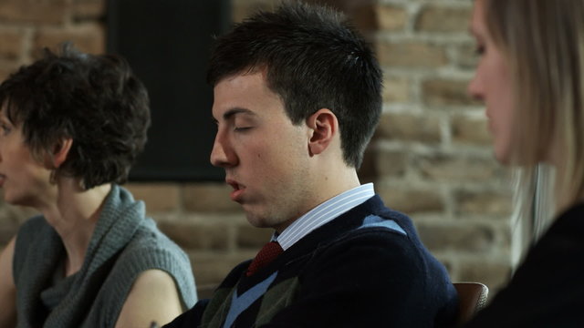 man falling asleep in a meeting