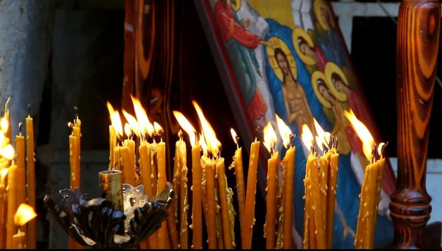 Candles at baptismal site in the Jordan River Holy Land Israel FULL HD