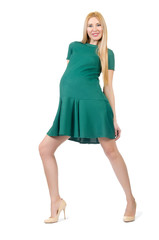 Beautiful pregnant woman in green dress isolated on white