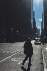 Casual single man silhouette walking on new york city streets