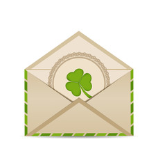 Open vintage envelope with clover isolated on white background f