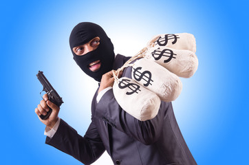 Gangster with bags of money on white