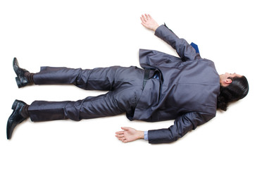 Businessman on the floor isolated on white