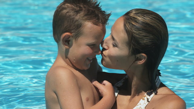 mother and son in a swimming pool