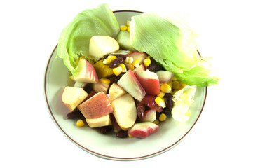 Fresh fruits salad in dish isolated on white