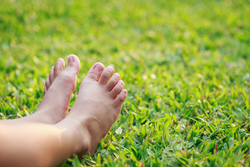 Children feet in the park