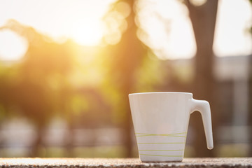 White coffee cup in the park