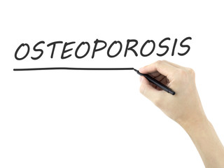 osteoporosis word written by man's hand