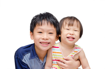 Asian brother and sister smiling over white background