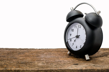 Clock on wood table over white background