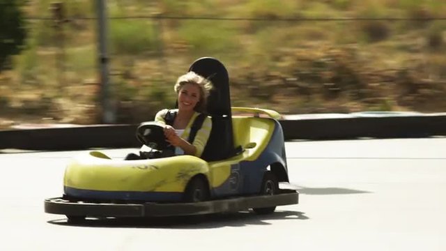 WS TS Young woman riding go-cart, Orem, Utah, USA